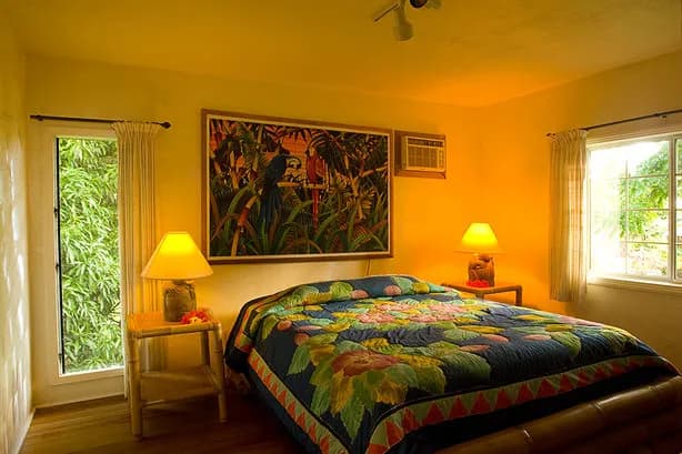 A room with a bed and windows A room with a bed and windows